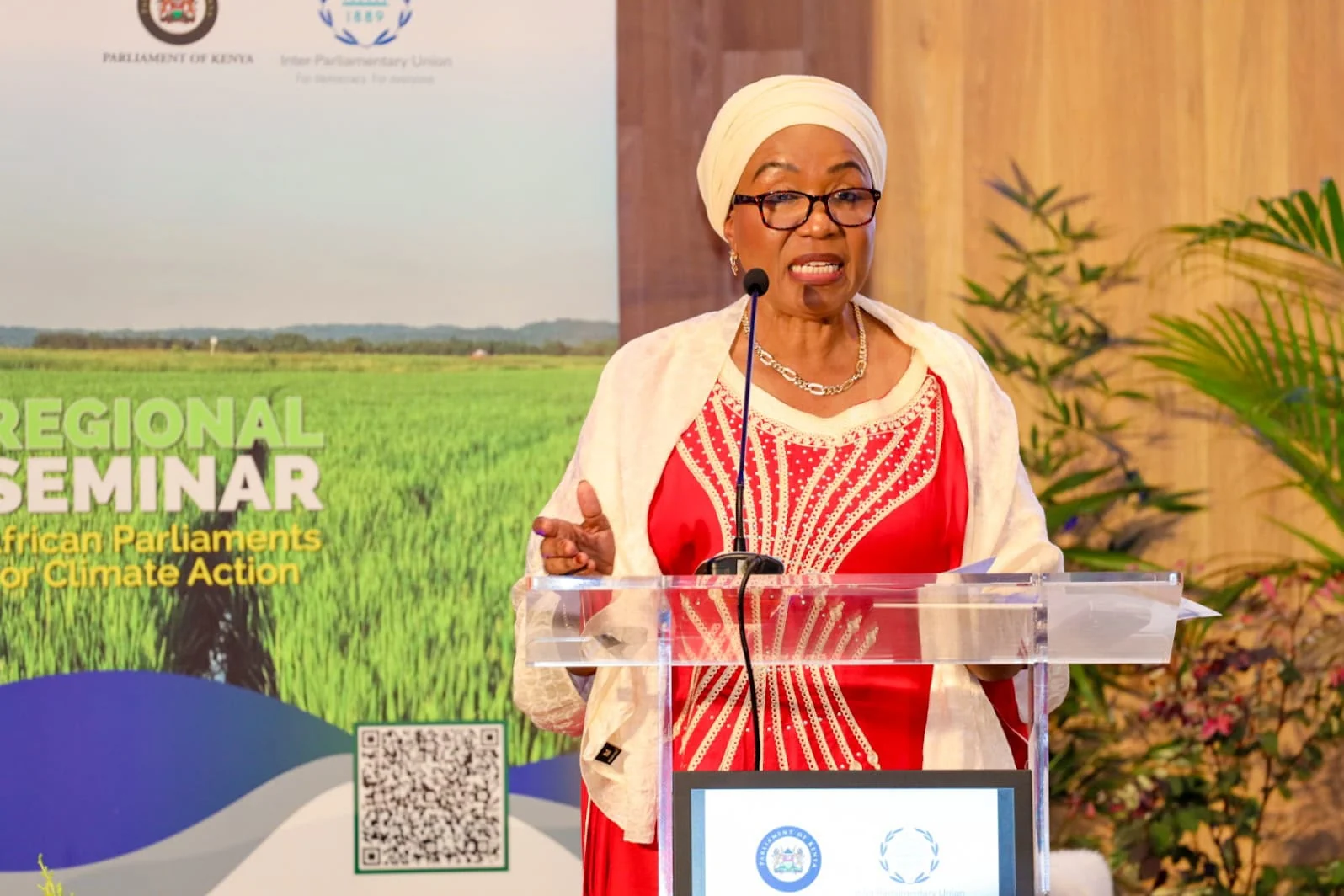 Hamida Kibwana speaking at a lectern in a client-supplied photograph